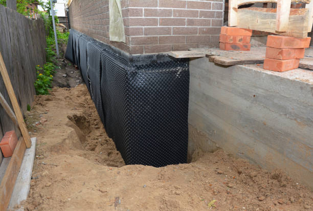 Happy homeowners after waterproofing job in Morrice